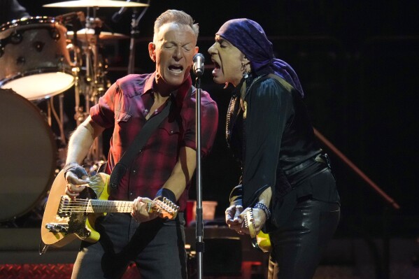 Bruce Springsteen, left, and Stevie Van Zandt, right, sing during a concert of Bruce Springsteen and The E Street Band World Tour 2024 performance Tuesday, March 19, 2024, in Phoenix. (AP Photo/Ross D. Franklin)