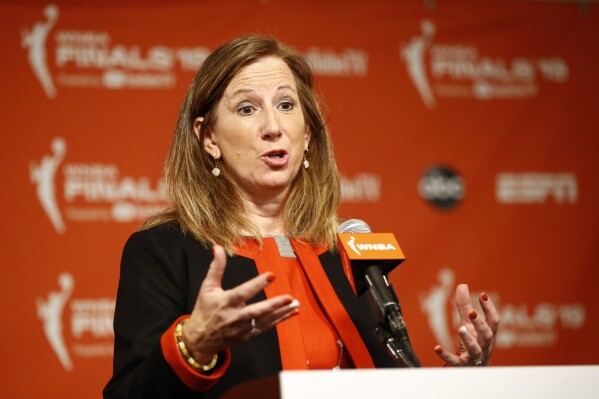 FILE - WNBA Commissioner Cathy Engelbert speaks at a news conference before Game 1 of basketball's WNBA Finals between the Connecticut Sun and the Washington Mystics, Sunday, Sept. 29, 2019, in Washington. Pulling together its charter flight program in the span of a few weeks caused a couple of early hiccups for the WNBA. The league plans to have everything running smoothly after the Olympic break. “It’s a big Rubik’s cube,” WNBA Commissioner Cathy Engelbert told The Associated Press in a phone interview Friday, May 31, 2024. (AP Photo/Patrick Semansky, File)