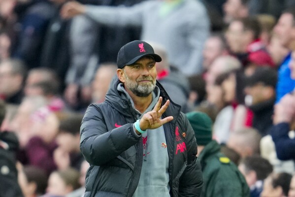 FILE - Liverpool's manager Jurgen Klopp gestures during the English Premier League soccer match between Liverpool and Arsenal at Anfield in Liverpool, England, Sunday, April 9, 2023. Klopp’s rebuild: Liverpool is undergoing its first big overhaul under Jurgen Klopp, with a completely new midfield adding to a much-changed forward line and the repositioning of Trent Alexander-Arnold. How quickly will Liverpool 2.0 come together and can they again become City’s biggest title rival? (AP Photo/Jon Super, File)
