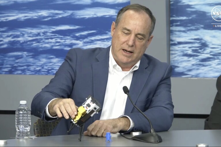 In this image from video provided by NASA, Steve Altemus, CEO and co-founder of Intuitive Machines, describes how it is believed the company's Odysseus spacecraft landed on the surface of the moon, during a news conference in Houston on Friday, Feb. 23, 2024. (NASA via AP)