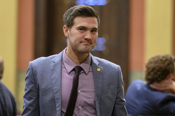 Rep. Josh Schriver on the floor of the Michigan House of Representatives, at the Michigan Capitol, in Lansing, Mich., on Oct. 10, 2023. The Republican lawmaker, Schriver, in Michigan lost his committee assignment and staff Monday, Monday, Feb. 12, 2024, days after posting an image of a racist ideology on social media. House Speaker Joe Tate, a Democrat who is Black, said he will not allow the House to be a forum for “racist, hateful and bigoted speech.” (David Guralnick/Detroit News via AP)