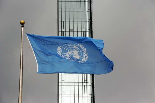 FILE - The United Nations flag flies on a stormy day at the U.N. during the United Nations General Assembly, Thursday, Sept. 22, 2022. Palestinians are hoping that a vote Tuesday, Dec. 12, 2023, in the U.N. General Assembly on a nonbinding resolution demanding an immediate humanitarian cease-fire will demonstrate widespread global support for ending the Israel-Hamas war, now in its third month. (AP Photo/Ted Shaffrey, File)