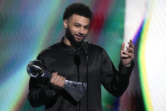Professional NBA basketball player Jamal Murray, of the Denver Nuggets, accepts the award for best comeback athlete at the ESPY awards on Wednesday, July 12, 2023, at the Dolby Theatre in Los Angeles. (AP Photo/Mark J. Terrill)