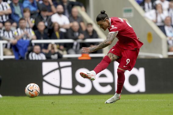 Liverpool's Darwin Nunez scores his sides first goal during the English Premier League soccer match between Newcastle United and Liverpool at St. James' Park, in Newcastle upon Tyne, England, Sunday Aug. 27, 2023. (Owen Humphreys/PA via AP)