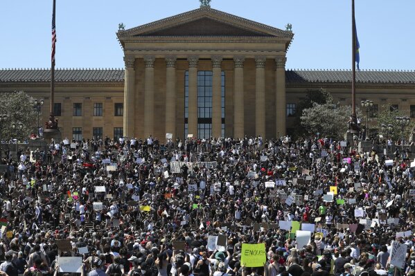 Protesters take to the Art Museum steps in Philadelphia, Saturday, May 30, 2020, during a protest over the death of George Floyd. Floyd died in Minneapolis police custody on May 25. (Heather Khalifa/The Philadelphia Inquirer via AP)