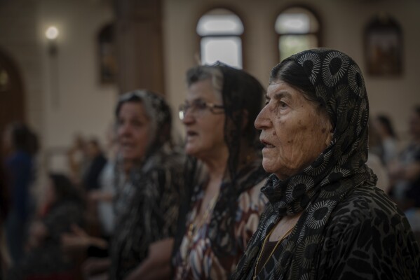 Chaldean Christians attend a service in the Mar Youssef Cathedral in Irbil, Iraq, on Sunday, July 30, 2023. Today, the number of Christians in Iraq is 150,000, compared to 1.5 million in 2003. (AP Photo/Julia Zimmermann/Metrography)