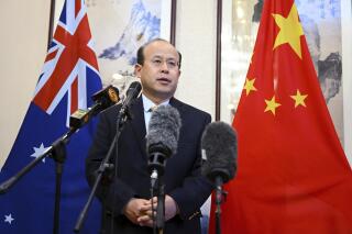 China's Ambassador to Australia Xiao Qian speaks to media at the Embassy of China in Canberra, Thursday, May 18, 2023. Xiao asked Australian authorities Thursday to increase efforts to find survivors in an Indian Ocean search for 39 missing from a capsized Chinese fishing boat. (Lukas CochAAP Image via AP)