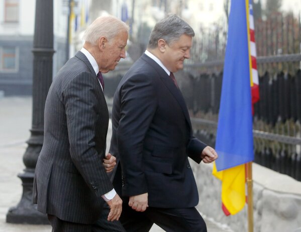 FILE - In this Jan. 16, 2017, file photo Vice President Joe Biden, left, and Ukrainian President Petro Poroshenko go for talks during Biden's visit in Kiev, Ukraine. The leaked recordings of apparent conversations between Joe Biden and Ukraine’s then-president largely confirm Biden’s account of his dealings in Ukraine. The choppy audio, disclosed by a Ukrainian lawmaker whom U.S. officials described Thursday, Sept. 10, 2020, as an “active Russian agent” who has sought to spread online misinformation about Biden. (AP Photo/Efrem Lukatsky, File)