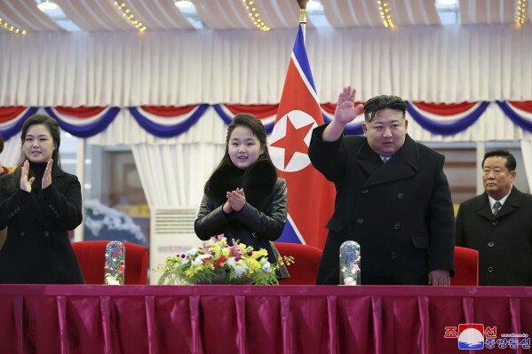 In this photo provided by the North Korean government, North Korean leader Kim Jong Un, second right, with his daughter and his wife Ri Sol Ju, left, attends a performance to celebrate the New Year in Pyongyang, North Korea, Sunday, Dec. 31, 2023. Independent journalists were not given access to cover the event depicted in this image distributed by the North Korean government. The content of this image is as provided and cannot be independently verified. Korean language watermark on image as provided by source reads: 