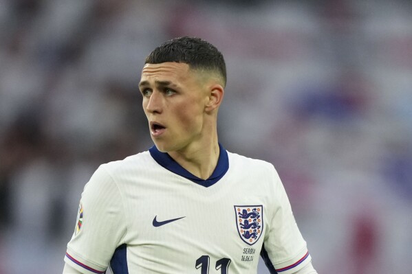  England's Phil Foden looks on during a Group C match between Serbia and England at the Euro 2024 soccer tournament in Gelsenkirchen, Germany, Sunday, June 16, 2024. (AP Photo/Martin Meissner)
