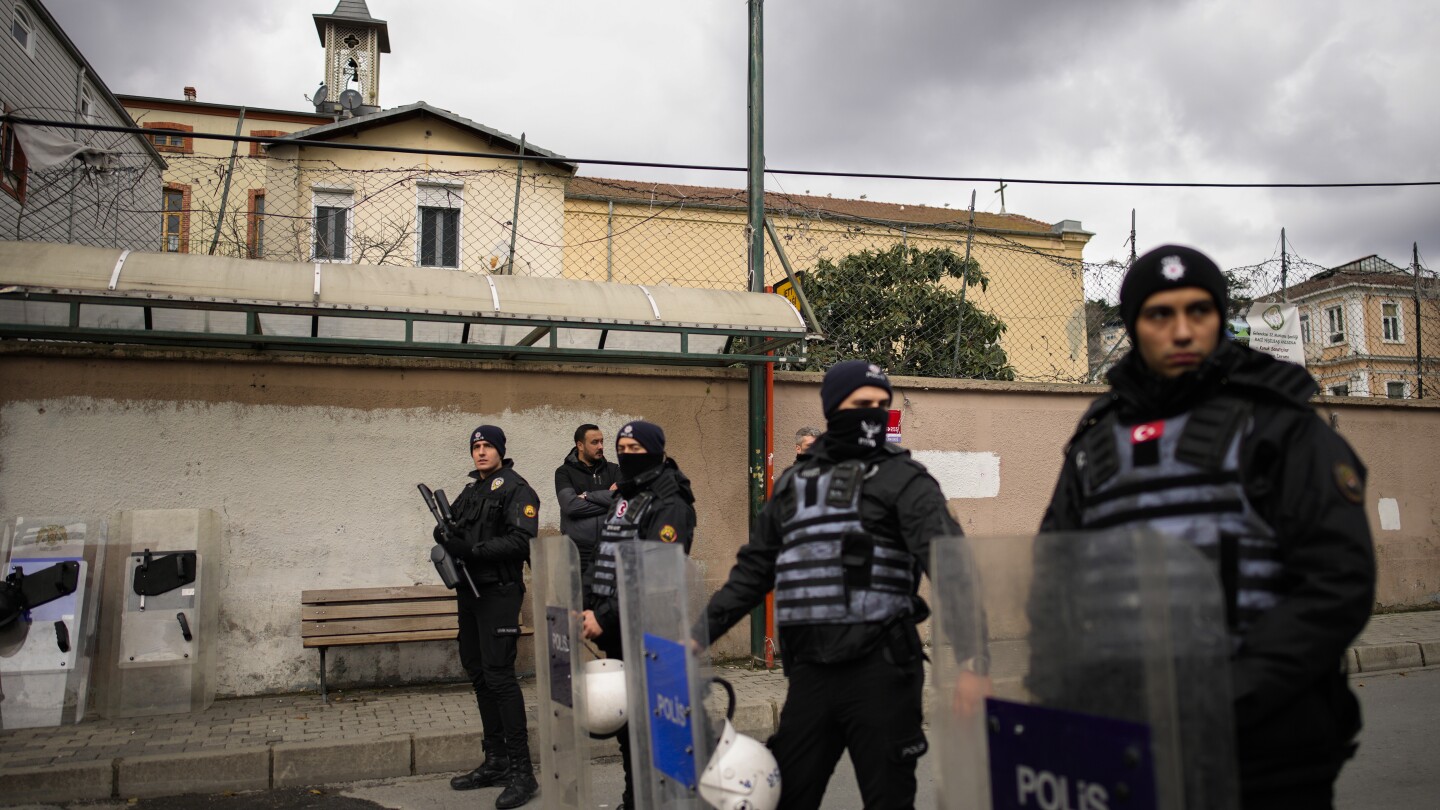 2 masked men kill a person in attack on Catholic church in Istanbul. Officials detain 2 ISIS members