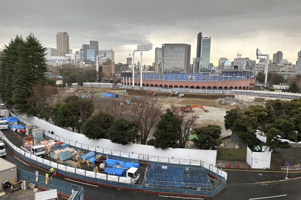 FILE - A view of the expanse of trees around Tokyo's Jingu Gaien area that are slated to be cut in order to build three skyscrapers in one of the city's most beloved park areas Saturday, Jan. 13, 2024. The Japanese bar association is urging Tokyo's metropolitan government to suspend a disputed redevelopment of the city's beloved park area, saying that its environmental assessment by developers lacked objective and scientific grounds. (AP Photo/Stephen Wade, File)