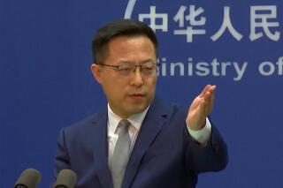 FILE - In this image made from video, Chinese Foreign Ministry spokesperson Zhao Lijian gestures during a media briefing that referred to reports of atrocities in the Ukrainian town of Bucha at the Ministry of Foreign Affairs office, on Wednesday, April 6, 2022, in Beijing. China has described reports and images of civilian killings in Ukraine as disturbing, and urged that they be further investigated, even while declining to blame Russia. That's drawn questions about the resiliency of Beijing's support for Moscow, but speculation that it is weakening appears to be misplaced. (AP Photo/Liu Zheng, File)