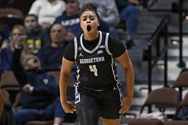 Georgetown guard Alex Cowan (4) reacts during the second half of an NCAA college basketball game against Creighton in the semifinals of the Big East Conference tournament at Mohegan Sun Arena, Sunday, March 10, 2024, in Uncasville, Conn. (AP Photo/Jessica Hill)