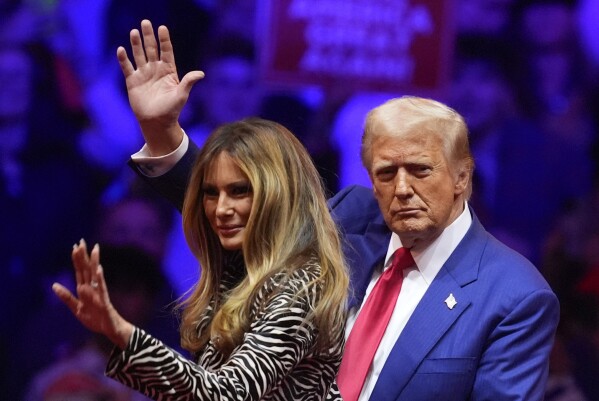 Republican presidential nominee former President Donald Trump and former first lady Melania Trump wave at a campaign rally at Madison Square Garden, Sunday, Oct. 27, 2024, in New York. (AP Photo/Evan Vucci)
