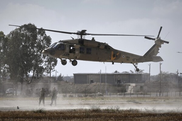 A military helicopter carrying relatives of Israeli-American soldier Edan Alexander lands ahead of his scheduled release from Hamas captivity in Gaza, in Reim, near the Gaza border, southern Israel, Monday, May 12, 2025.(AP Photo/Maya Alleruzzo)