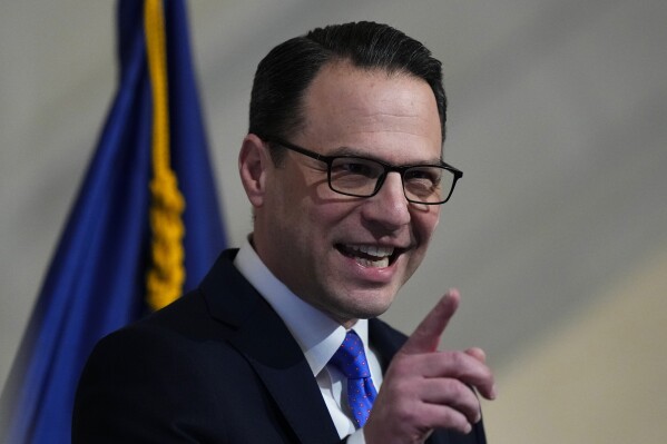 Gov. Josh Shapiro delivers his budget address for the 2024-25 fiscal year to a joint session of the Pennsylvania House and Senate in the Rotunda of the state Capitol in Harrisburg, Pa., Wednesday, Feb. 6, 2024. (AP Photo/Matt Rourke)