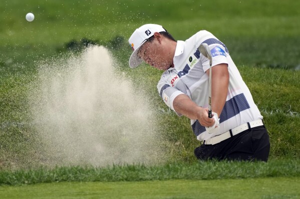 Sungjae Im, of Korea, practices hitting from the sand during a practice round of the Rocket Mortgage Classic golf tournament at Detroit Country Club, Wednesday, June 28, 2023, in Detroit. (AP Photo/Carlos Osorio)
