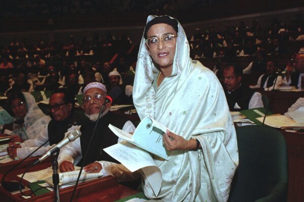 FILE- Bangladesh Prime Minister Sheikh Hasina speaks at the opening session in the national parliament in Dhaka, July 14, 1996. The elections in Bangladesh are all about one person: Prime Minister Sheikh Hasina. Analysts predict that since the main opposition party is staying out of the Jan. 7 vote, the 76-year-old leader is practically guaranteed her fifth term in office. (AP Photo/Pavel Rahman, File)