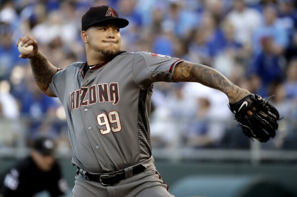 
              FILE - In this Sept. 30, 2017, file photo, Arizona Diamondbacks starting pitcher Taijuan Walker throws during the first inning of a baseball game against the Kansas City Royals in Kansas City, Mo. Walker will start Arizona's NL Division Series opener against the Dodgers after the craziness of the Diamondbacks' wild-card game depleted their pitching staff. (AP Photo/Charlie Riedel, File)
            