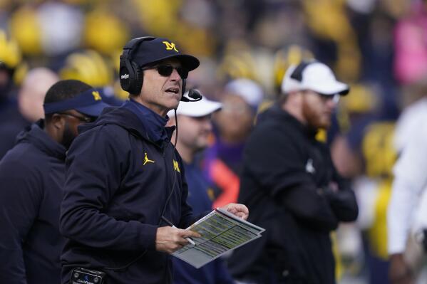 Michigan head coach Jim Harbaugh watches from the sideline during the second half of an NCAA college football game against Northwestern, Saturday, Oct. 23, 2021, in Ann Arbor, Mich. (AP Photo/Carlos Osorio)