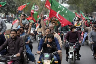 Supporters of imprisoned Pakistan's former Prime Minister Imran Khan on motorcycles chant slogans during a protest against the Pakistan Election Commission, in Lahore, Pakistan, Sunday, March 10, 2024. (AP Photo/K.M. Chaudary)