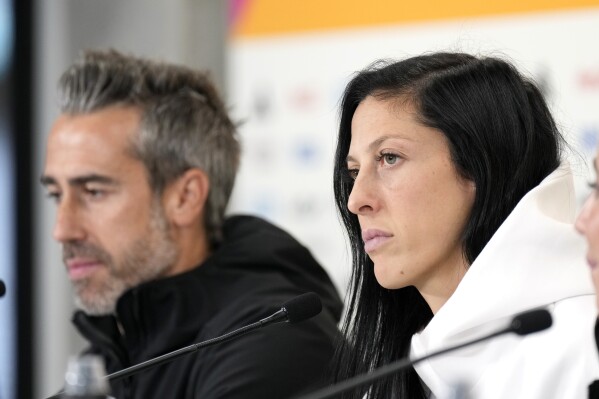 FILE - Spain's Jennifer Hermoso, right, and head coach Jorge Vilda listens to reporters questions during a press conference at Eden Park ahead of the Women's World Cup semifinal match between Spain and Sweden in Auckland, New Zealand, Monday, Aug.14, 2023. Jenni Hermoso said Friday, Aug. 25, that ‘in no moment’ did she consent to a kiss on the lips by soccer federation president Luis Rubiales. Hermoso issued a statement through her union hours after Rubiales claimed in an emergency meeting of the Spanish soccer federation that the kiss was consensual. (AP Photo/Alessandra Tarantino, File)