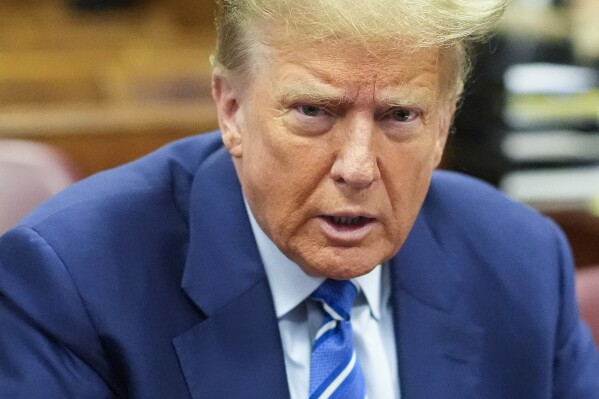 Former President Donald Trump awaits the start of proceedings on the second day of jury selection at Manhattan criminal court, Tuesday, April 16, 2024, in New York. Donald Trump returned to the courtroom Tuesday as a judge works to find a panel of jurors who will decide whether the former president is guilty of criminal charges alleging he falsified business records to cover up a sex scandal during the 2016 campaign. (AP Photo/Mary Altaffer, Pool)