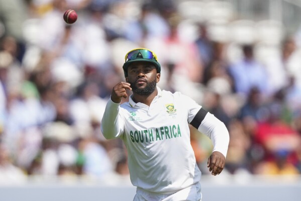 South Africa's captain Temba Bavuma wears a black armband in honor of the victims of Thursday's plane crash in India, on day three of the World Test Championship final between South Africa and Australia at Lord's cricket ground in London, Friday, June 13, 2025. (AP Photo/Kirsty Wigglesworth)