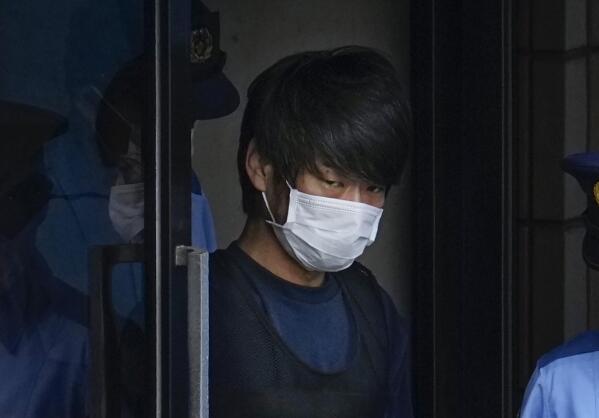 FILE - Tetsuya Yamagami, the alleged assassin of former Japanese Prime Minister Shinzo Abe, gets out of a police station in Nara, western Japan, on July 10, 2022, on his way to local prosecutors' office. A glimpse of Yamagami's painful childhood has led to a surprising amount of sympathy in Japan, where three decades of economic malaise and social disparity have left many feeling isolated and unease. (Nobuki Ito/Kyodo News via AP, File)