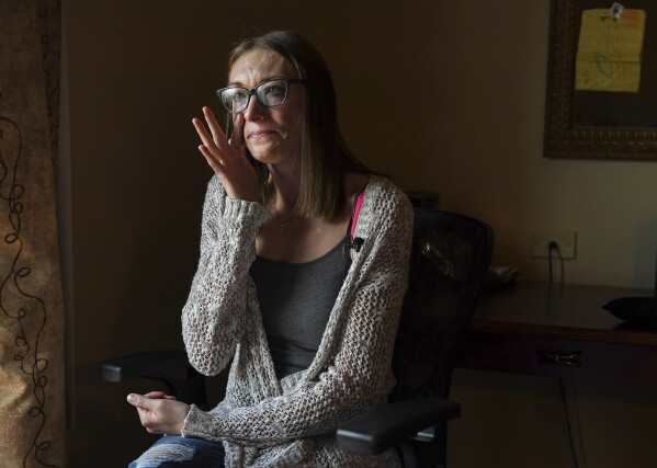 Alexandria Johnson, 35, becomes emotional during an interview, Thursday, Nov. 2, 2023, in Oneonta, N.Y., while recalling details of being sexually assaulted while incarcerated. Johnson filed separate lawsuits against New York City and the state corrections department under the Adult Survivors Act, alleging repeated sexual assaults while she was incarcerated at Rikers Island, as well as at the state's Bedford Hills facility that led to the termination of her pregnancy. "I had to take a chance that there would be justice," said Johnson, of her decision to file the law suits. (AP Photo/Heather Ainsworth)