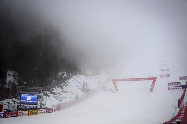 Fog takes posses of the finish area, as the race is posponed waiting for the track to clear at an alpine ski, women’s World Cup downhill race in Crans Montana, Switzerland, Saturday, Feb. 25, 2023. (Alessandro della Valle/Keystone via AP)