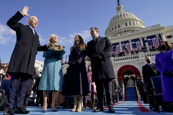 Joe Biden is sworn in as the 46th president of the United States by Chief Justice John Roberts as Jill Biden holds the Bible during the 59th Presidential Inauguration at the U.S. Capitol in Washington, Wednesday, Jan. 20, 2021, as their children Ashley and Hunter watch.(AP Photo/Andrew Harnik, Pool)