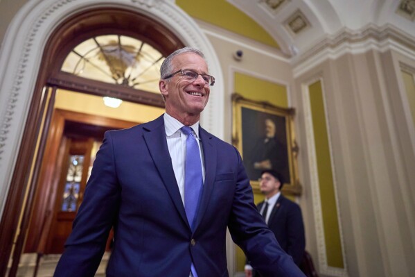 Senate Majority Leader John Thune, R-S.D., leaves the chamber Wednesday afternoon with plans to take up voting on the GOP's sweeping mega bill by next week despite lack of support from key fiscal hawks, at the Capitol in Washington, Wednesday, June 18, 2025. (AP Photo/J. Scott Applewhite)