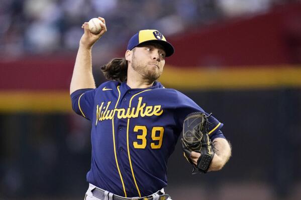 Milwaukee Brewers starting pitcher Corbin Burnes throws to an Arizona Diamondbacks batter during the first inning of a baseball game Tuesday, April 11, 2023, in Phoenix. (AP Photo/Ross D. Franklin)