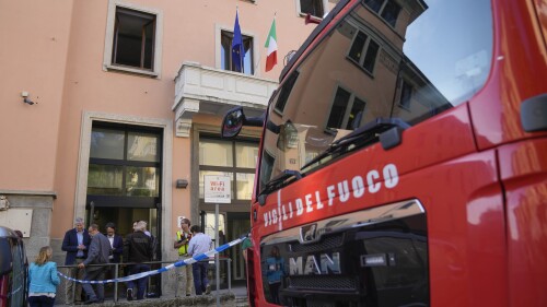 A firefighter truck is parked outside the "Casa per Coniugi" nursing home where a fire broke out overnight causing the death of six people in Milan, Italy, Friday, July 7, 2023. (AP Photo/Antonio Calanni)