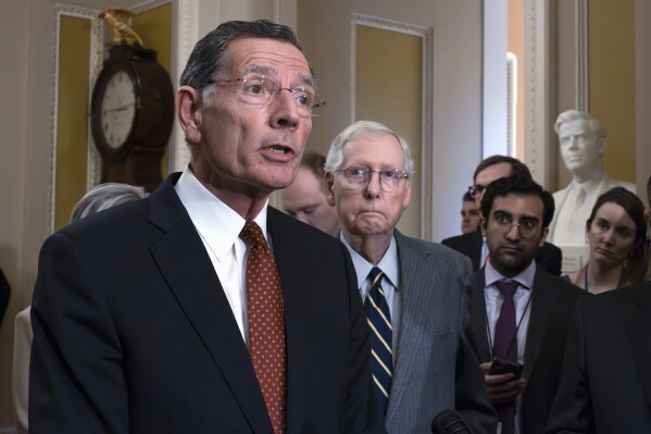 Sen. John Barrasso, R-Wyo., left, joined by Senate Minority Leader Mitch McConnell, R-Ky., speaks to reporters at the Capitol in Washington, Wednesday, March 6, 2024. (AP Photo/J. Scott Applewhite)