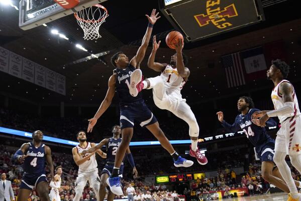 Iowa State guard Izaiah Brockington (1) shoots over Jackson State center Jayveous McKinnis (11) during the first half of an NCAA college basketball game, Sunday, Dec. 12, 2021, in Ames, Iowa. (AP Photo/Charlie Neibergall)
