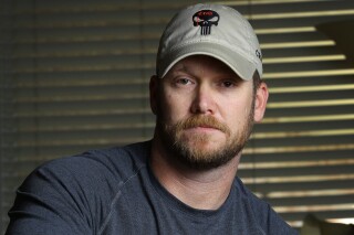 In this April 6, 2012, photo, former Navy SEAL and author of the book American Sniper poses in Midlothian, Texas. A Texas sheriff has told local newspapers that Kyle has been fatally shot along with another man on a gun range, Saturday, Feb. 2, 2013. (AP Photo/The Fort Worth Star-Telegram, Paul Moseley)  