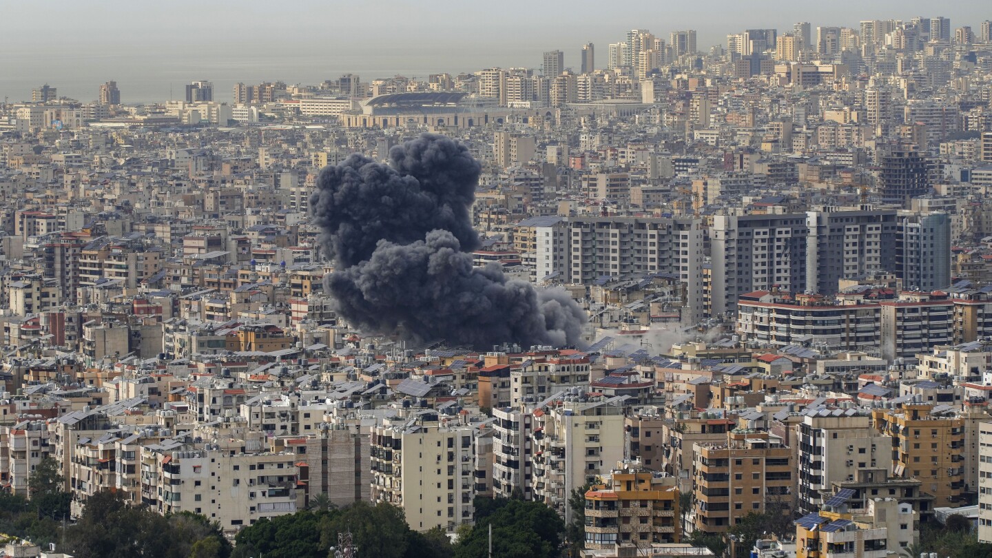 Israel vows to retaliate against attacks from Lebanon and warns people to leave Beirut suburb