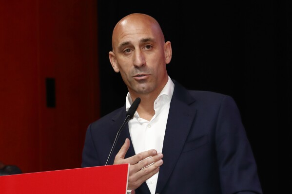 The president of the Spanish soccer federation Luis Rubiales speaks during an emergency general assembly meeting in Las Rozas, Friday Aug. 25, 2023. Rubiales has refused to resign despite an uproar for kissing a player, Jennifer Hermoso on the lips without her consent after the Women's World Cup final. Rubiales had also grabbed his crotch in a lewd victory gesture from the section of dignitaries with Spain's Queen Letizia and the 16-year old Princess Sofía nearby. (Real Federación Española de Fútbol/Europa Press via AP)