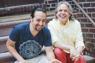 In this undated photo provided by Monica Simoes, Lin-Manuel Miranda, left, laughs with his father Luis Miranda Jr.  The award-winning “Hamilton” creator says the inspirations for his art and philanthropy are linked. With a series of donations to organizations helping immigrants announced Tuesday, July 6, 2021, Miranda and his family’s nonprofit will support the new focus on immigration in the movie version of his musical “In the Heights.”   (Monica Simoes via AP)