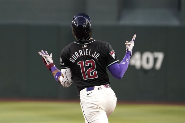 Arizona Diamondbacks' Lourdes Gurriel Jr. gestures after hitting a three-run home run against the St. Louis Cardinals during the sixth inning of a baseball game Saturday, April 13, 2024, in Phoenix. (AP Photo/Darryl Webb)