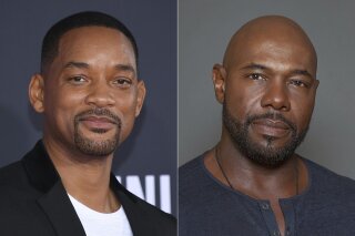 Will Smith attends the premiere of "Gemini Man" in Los Angeles on Oct. 6, 2019, left, and director Antoine Fuqua appears during a photo session in Los Angeles on July 12, 2015. Smith and director Fuqua have pulled production of their runaway slave drama “Emancipation” from Georgia over the state’s recently enacted law restricting voting access. The film is largest and most high profile Hollywood production to depart the state since Georgia’s Republican-controlled state Legislature passed a law that introduced stiffer voter identification requirements for absentee balloting. (AP Photo)