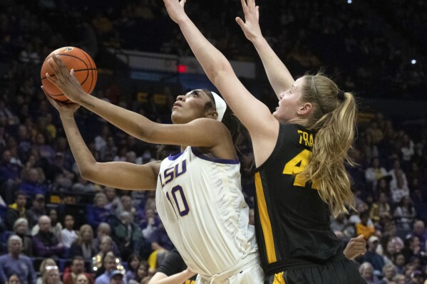 FILE - LSU forward Angel Reese (10) drives past Missouri forward Hayley Frank (43) during an NCAA college basketball game Thursday, Jan. 4, 2024, in Baton Rouge, La. As March Madness is set to tip off, three of the most recognizable names in college basketball are in the women’s tournament: Caitlin Clark, Angel Reese and Paige Bueckers.(Hilary Scheinuk/The Advocate via AP, File)