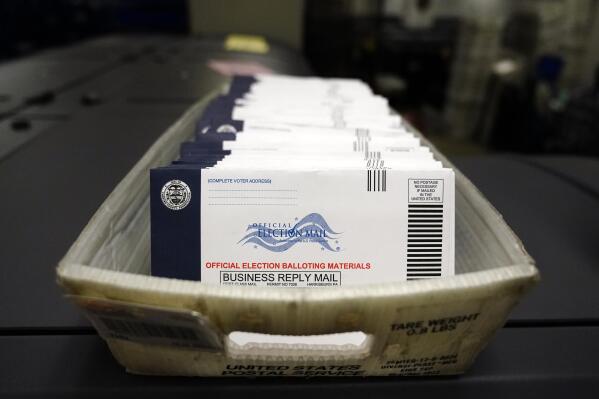 FILE—This file photo from Oct. 23, 2020, shows mail-in ballots for the U.S. 2020 General Election before being sorted at the Chester County Voter Services office, in West Chester, Pa. A statewide court said Friday Jan. 28, 2022 that Pennsylvania's expansive two-year-old mail-in voting law is unconstitutional, agreeing with challenges by Republicans. Friday's decision by a five-judge Commonwealth Court panel could be put on hold immediately by an appeal from Gov. Tom Wolf's administration to the state Supreme Court. (AP Photo/Matt Slocum, File)
