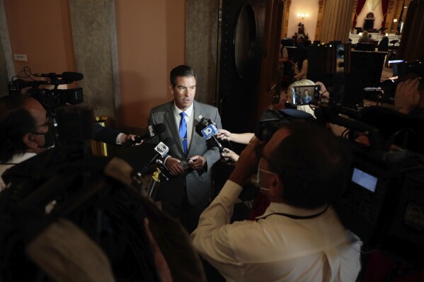 FILE - Ohio Rep. Craig Riedel speaks with members of the media after the Ohio House of Representatives voted 90-0 to remove Rep. Larry Householder, as Speaker of the House on Thursday, July 30, 2020 at the Ohio Statehouse in Columbus, Ohio. Since last year, GOP candidates for Ohio’s 9th Congressional District have left and entered the field on a dime, endorsements have hopped from campaign to campaign, and several big-name Republicans have split their loyalties three ways. (Joshua A. Bickel /The Columbus Dispatch via AP, File)