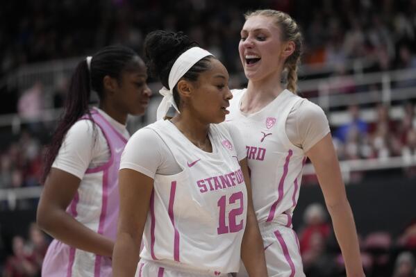 Stanford guard Indya Nivar (12) celebrates with forward Cameron Brink, right, after a block against Southern California during the first half of an NCAA college basketball game in Stanford, Calif., Friday, Feb. 17, 2023. (AP Photo/Godofredo A. Vásquez)