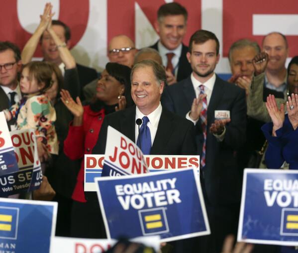 FILE - In this Tuesday, Dec. 12, 2017 file photo, Democrat Doug Jones speaks in Birmingham, Ala.  Roy Moore is going to court to try to stop Alabama from certifying Jones as the winner of the U.S. Senate race. Moore filed a lawsuit Wednesday evening, Dec. 27, 2017, in Montgomery Circuit Court.  (AP Photo/John Bazemore, File)