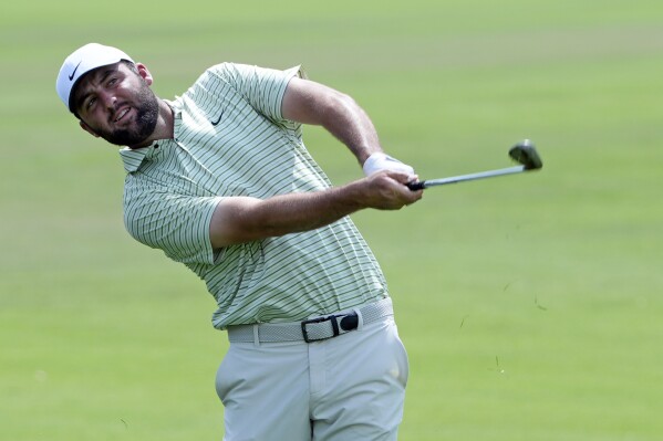 Scottie Scheffler hits from the first fairway during the third round of the Arnold Palmer Invitational golf tournament Saturday, March 9, 2024, in Orlando, Fla. (AP Photo/John Raoux)